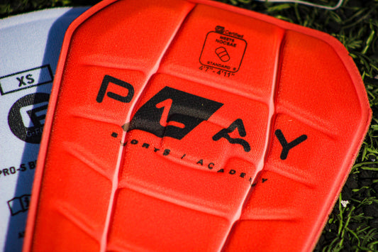 ESPINILLERAS PRO-S BLADE NOCSAE SHINGUARD P1AY NARANJA